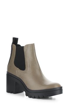 A treaded sole and block heel lift this classic Chelsea boot featuring logo detailing on the pull tab and a cushioned footbed. 3" heel; 1 1/4" platform 4 1/2" shaft Pull-on style with elastic gore insets Cushioned insole Leather upper/synthetic lining/rubber sole Made in Portugal Women's Shoes | Fly London Tope Chelsea Boot Chelsea Boot Women, Fly London, Pull On Boots, Leather Chelsea Boots, Leather Boot, Chelsea Boot, Lug Sole, Boot Shoes Women, Chunky Heels