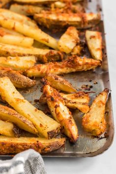 baked french fries on a baking sheet ready to be eaten