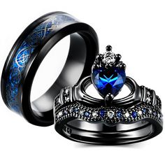 two wedding rings with blue and white diamonds on each ring, one has a heart shaped sapphire