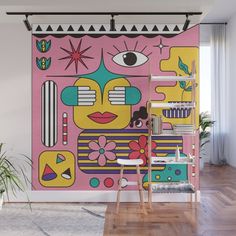 a pink wall with an abstract painting on it's face and various objects surrounding it