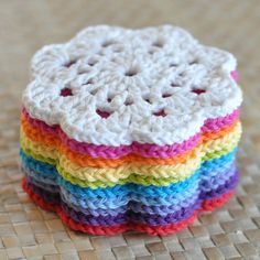 a stack of crocheted coasters sitting on top of a table