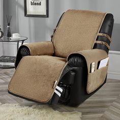 the recliner chair is covered with a brown blanket and black leather trimmings