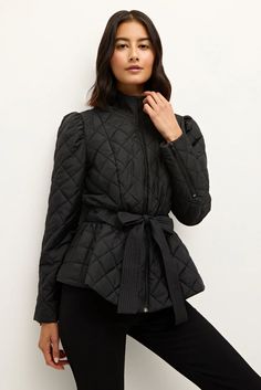 Our best-selling Raven Jacket is back! Marie Oliver’s feminine take on the classic quilted jacket features tailored details like trapunto stitching around a structured collar and a tie belt that accentuates your waist before flaring out into a peplum flounce at the hem. This season, Raven lives up to her name, coming in a sophisticated black solid. -Peplum Detail with Waist Tie-Zipper Sleeve Detail-Slim fit through sleeve and body-100% Polyester-Lined-Care Instructions: Spot Clean Only Black Solid, Sleeve Detail, Quilted Jacket, Tie Belt, Waist Tie, Denim Dress, Care Instructions, Coats Jackets, Stitching