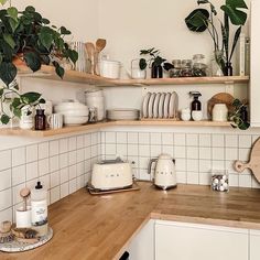 the kitchen counter is covered with pots and pans, dishes, and utensils