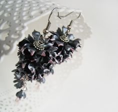 "Nacreous black and touch of pink - chic and stylish! Look at this statement earrings with polymer clay flowers. Original hand made long cluster earrings in gothic look. This unique earrings are made of polymer clay flowers which are covered nacreous paint. It will be absolutely perfect for a wedding as an added statement to complete the look in gothic style. May be a great gift for women. The last pic shows how the similar earrings looks on a person. The length of the earrings 3 3/4\" Free ship Handmade Flower-shaped Earrings For Evening, Handmade Flower-shaped Evening Earrings, Handmade Flower Earrings For Evening, Elegant Black Flower Earrings For Wedding, Handmade Black Drop Flower Earrings, Handmade Black Drop Earrings, Handmade Black Wedding Earrings, Elegant Black Polymer Clay Jewelry, Gothic Wedding Party