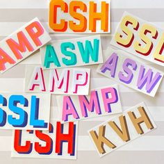 several different colored stickers on a white background with the words csh, asw, amp, and ssl