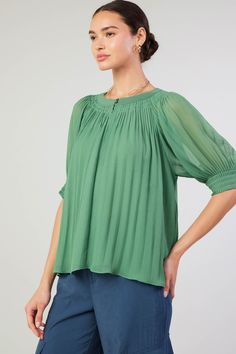 This sheer top is so ethereal, it practically floats against the body. Accented by tonal trim at the neckline, it's got pleat detailing that enhances the easy drape. •Round neckline with button fastenings •Front keyhole •Short sleeves •Pleating at neckline and cuffs •Relaxed fit •Lined Item number 2430207 100% Polyester Summer Billowy Blouse With Pleated Sleeves, Summer Blouse With Billowy Pleated Sleeves, Billowy Blouse With Pleated Sleeves For Summer, Summer Solid Blouse With Crinkle Texture, Solid Summer Blouse With Pleated Sleeves, Spring Green Tops With Crinkle Texture, Flowy Solid Color Spring Blouse, Flowy Solid Spring Blouse, Green Crinkle Texture Tops For Spring