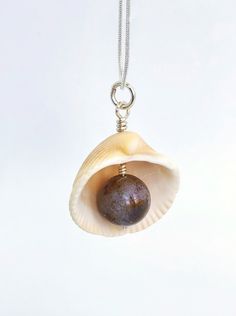 This is a wonderful pendant made of a natural Atlantic seashell and natural Agate. My seashells are harvested on Melbourne beach in Florida. The inner shell has beautiful pink and purple color to it and looks very authentic in combination with agate. The pendant makes a great souvenir from Florida for ocean lovers and sustainable friends.Agate is well known for its calming, soothing effects on the mind, primarily when used over some time. It can help enhance mental clarity and improve concentrat Ocean-inspired Abalone Shell Gift, Pearl Pendant Shell As Gift, Pearl Pendant Shell Gift, Spiritual Shell Necklace Gift, Ocean-inspired Shell Necklace As Gift, Spiritual Healing Shell Jewelry, Spiritual Shell Necklace As Gift, Abalone Shell Necklace As A Gift, Natural Shell Necklace As Gift