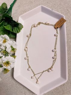 The Camille pearl necklace boasts freshwater pearls on a 32-inch chain for endless styling possibilities. It is available in 24k gold-plated or Rhodium-plated, making it an ideal accessory for any occasion. Our gold-plated chains are tarnish resistant, but require more care. Gold-plated chains can be worn for months with no tarnish, but it's not recommended to shower, sweat, or swim with them. Gold-filled chains are available for those who want more durable chains that never have to be removed. Double Strand Pearl Chain Necklace As Gift, Gold Double Strand Pearl Necklaces, Long Pearl Pendant Chain Necklace, Long Pearl Chain Necklace With Pearl Pendant, Dainty Long Pearl Necklace, Gold Double Strand Pearl Necklace, Gold Double Strand Pearl Necklace With Adjustable Chain, Long Pearl Drop Chain Necklace, Gold Pearl Chain Necklace For Gift