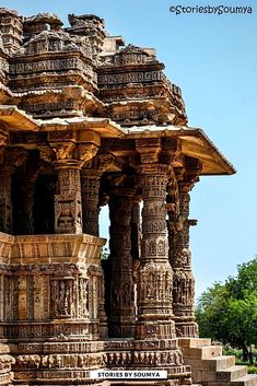 an ornate stone structure with columns and pillars