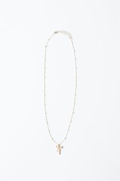 Add a touch of whimsy to your outfit with our Bow Drop Necklace. This beaded 14k gold filled or sterling silver beaded necklace features a sparkling rhinestone bow, adding a playful and elegant touch to any look. Perfect for gifting or treating yourself!" Length: 14”-17” (includes a 3 inch extender). Crafted with 14K Gold Filled or Sterling Silver Chain and Gold Cubic Zirconia Bow Handmade with love from San Clemente, CA. Elegant Tiny Beads Charm Necklaces As Gifts, Elegant Charm Necklaces With Tiny Beads, Elegant Charm Necklaces With Tiny Beads For Gifts, Elegant Charm Necklace With Tiny Beads For Gift, Gold Beaded Charm Necklaces For Party, Gold Beaded Charm Necklace For Party, Dainty Beaded Charm Necklaces As Gift, Dainty Beaded Charm Necklace For Gift, Dainty Gold Beaded Charm Necklaces