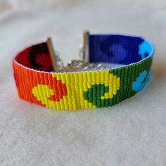 a bracelet made out of legos on a white surface