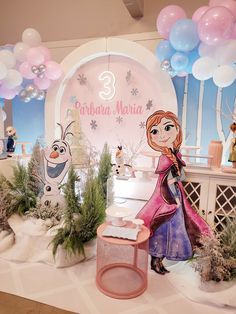 a frozen princess birthday party with balloons and decorations