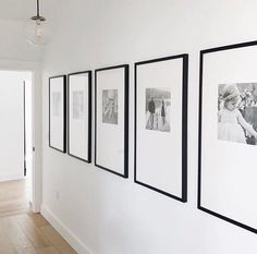 four black and white photographs hanging on the wall