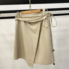 Beautiful Leather Waistband Miniskirt Summer Office Mini Skirt, Summer Office Skirt Short Length, Beige Asymmetrical Mini Skirt For Workwear, Summer Office Mini Skirt With Lining, Spring Workwear Mini Wrap Skirt, Beige Mini Skirt For Office In Summer, Lined Mini Skirt For Summer Office Wear, Beige Office Mini Skirt For Summer, Solid Color Mini Wrap Skirt For Spring