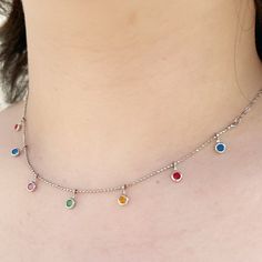 Dainty Silver Colour Stones Choker Necklace Adorned with a splendid array of colored stones, each carefully chosen for its radiant hues, this necklace is a true celebration of color and vitality. The stones, skillfully arranged in an intricate pattern, exude a mesmerizing brilliance, reflecting light and casting a spell wherever you go. Perfect for both casual and formal occasions, this choker necklace effortlessly adds a pop of color and a dash of glamour to your ensemble. Its adjustable length Multicolor Pendant Charm Necklace, Multicolor Adjustable Clavicle Chain Necklace, Adjustable Multicolor Clavicle Chain Necklace, Multicolor Dangle Charm Necklaces With Adjustable Chain, Colorful Jewelry With Adjustable Chain, Multicolor Dangle Charm Necklace With Adjustable Chain, Multicolor Clavicle Chain Choker As Gift, Multicolor Jeweled Choker Necklace, Multicolor Crystal Clavicle Necklace