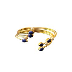 The Jahnavi Bracelet embodies the vibrant essence of the River Ganga with its luxurious blend of contrasting stones set in gold. Featuring custom-cut Lapis lazuli and ivory pearls, it creates a regal and dynamic accessory. Elegant Natural Stones Cuff Bangle Bracelet, Elegant Cuff Bracelet With Natural Stones, Elegant Natural Stone Cuff Bangle, Elegant Natural Stones Cuff Bracelet, Elegant Adjustable Stones Bangle, Elegant Adjustable Bangle With Stones, Gold Bracelets With Lapis Lazuli And Natural Stones, Elegant Gold Beaded Bracelets With Gemstone Accents, Gold Bracelet With Natural Stones For Wedding