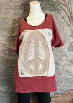 Jaded Gypsy Rock the Cutest Peace Sign Applique with Jaded Gypsy's Perfect Tee! Simple Distressing to Take Your Look to the Next Level! Cold water wash and hang to dry Made in the USA Bohemian Distressed Short Sleeve T-shirt, Bohemian Red Cotton T-shirt, Red Bohemian Cotton T-shirt, Red Relaxed Fit Top For Festival, Pre-washed Short Sleeve Graphic Tee, Bohemian Pre-washed Cotton Tops, Red Cotton T-shirt For Festival, Hippie Short Sleeve Tops With Screen Print, Hippie Style Short Sleeve Top With Screen Print