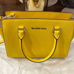 No Longer Has Tags But Still In Original Wrappers & Dust Bag. Beautiful Yellow Color! Measurements Shown In Photos. Classic Yellow Shoulder Bag With Detachable Handle, Classic Yellow Top Handle Bag, Yellow Rectangular Bag With Branded Hardware, Yellow Rectangular Bags With Branded Hardware, Classic Yellow Shoulder Bag With Gold-tone Hardware, Yellow Shoulder Bag With Branded Hardware For Travel, Yellow Travel Bag With Branded Hardware, Modern Yellow Bags With Gold-tone Hardware, Yellow Crossbody Bag With Branded Hardware