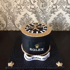 a birthday cake made to look like a rolex hat