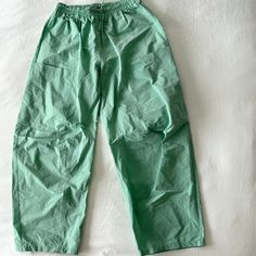 These Super Trendy Uo Pant Don't Have Tags But Have Never Been Used!!!!! - Wide Leg - Baggy - Green Color Has A Slight Shimmer In The Sunlight - Adjustable Drawstring Waistband - Nylon Fabric - 2 Pockets Green Parachute Pants With Elastic Waistband, Relaxed Fit, Green Relaxed Fit Parachute Pants With Elastic Waistband, Green Parachute Pants With Relaxed Fit And Elastic Waistband, Green Parachute Pants For Spring Loungewear, Green Relaxed Fit Parachute Pants For Summer, Casual Pants With Elastic Waistband By Urban Outfitters, Urban Outfitters Relaxed Fit Pants For Loungewear, Casual Loungewear Pants From Urban Outfitters, Casual Loungewear Pants By Urban Outfitters