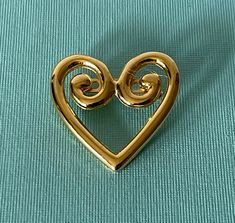 Vintage gold tone heart brooch                              020920 Pin is in good condition. Please see pictures for exact condition and size It comes from a clean, smoke free home. I ship quickly and offer free domestic shipping to the United States. **Buyers in the United Kingdom, please be aware that if you spend over 15 GBP, there are custom charges and handling charges from Royal Mail. Thanks for looking  Please read our return policy before purchasing. We package well and ship quickly! Vintage Gold Heart Brooches, Elegant Gold Brooches For Valentine's Day, Elegant Gold Brooch For Valentine's Day, Gold Heart Brooch For Formal Occasions, Gold Heart-shaped Brooch For Formal Occasions, Gold Heart Brooch For Formal Wear, Gold Brooches For Valentine's Day, Gold Brooches For Valentine's Day Formal, Gold Brooches For Formal Valentine's Day