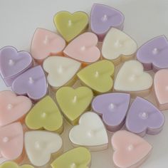 small heart shaped candles sitting on top of each other