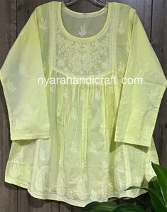 Pure cotton Chikankari hand embroidered a line blouse. Length: 30 inches Luxury Chikankari Embroidery Top For Party, Yellow Long Sleeve Top With Chikankari Embroidery, Festive Yellow Top With Chikankari Embroidery, Yellow Cotton Tops With Resham Embroidery, Cotton Long Sleeve Tops With Cutdana, Long Sleeve Cotton Blouse With Cutdana, Long Sleeve Tops With Chikankari Embroidery For Diwali, Traditional Cotton Blouse With Yoke, Yellow Chikankari Embroidered Festive Top