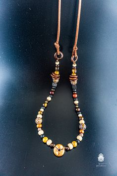 "A beautiful unisex boho necklace, perfect for men and women. It has a very oriental / Indian vibe to it. Great for any occasion. The full length is 80 cm, so reaches the solar plexus as in the photos above. It's a fixed size. Feel free to contact me if you prefer a different size! This one is another of my special pieces that have bits from all over the world! The pendant is made of wood in an African Style, and the beads are from all over the world: Rudrashtaka seeds from India, Tiger eye ston Hand-strung Hippie Jewelry For Meditation, Hippie Hand-strung Jewelry For Meditation, Beaded Bohemian Necklaces, Adjustable Long Festival Necklace, Multicolor Bohemian Necklaces For Everyday Use, Bohemian Multicolor Necklaces For Everyday, Everyday Bohemian Jewelry, Adjustable Bohemian Necklace For Meditation, Multicolor Bohemian Jewelry For Everyday Use