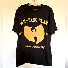 Wu Tang Forever Black Tee... Made From A Soft, Washed-Down Cotton In A Relaxed Fit. Complete With Logo Graphics At The Front Unisex Fit, Perfect For Men Or Women. -Screen Print Accent. - Interior Printed Brand Label On Neck -Material: 100% Cotton -Photo Of Actual Item -Approx. S Chest 18” Length 27” M Chest 20” Length 28” L Chest 22” Length 29” Wu Tang Forever Graphic Band T Shirt Wu Tang Forever, Wu Tang, Brand Label, Logo Graphic, Screen Print, Black Tee, Screen Printing, Tee Shirts, Mens Shirts