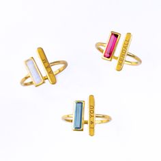 Breaking new ground with these adjustable Adira Series dainty gemstone and engraved bar rings. This modern bar ring features a carefully faceted rectangular natural birthstone paired with a bar engraved with a name, date or phrase.  Perfect for weddings, bridal parties, everyday, date night, and birthdays! Gemstone is approximately 10 x 3 mm (0.3 x 0.1 inches). This ring is available in different US SIZES ✦ Adjustable Size 5-6 ✦ Adjustable Size 7-8 ✦ Adjustable Size 9-10 Metal ✦ 18K Yellow Gold Modern Adjustable Stackable Rings For Gifts, Modern Adjustable Stackable Rings As A Gift, Modern Personalized Adjustable Stackable Rings, Gold Rings With Rectangular Stone For Gift, Personalized Adjustable Crystal Ring For Anniversary, Modern Birthstone Crystal Ring For Gift, Crystal Ring With Rectangular Gemstone For Gift, Rectangular Birthstone Ring For Gift, Rectangular Gemstone Crystal Ring Gift