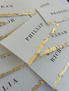 gold foiled business cards with names on them