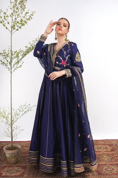 A royal blue frock in raw silk with embroidery on the bodice and a matching net dupatta with kiran along its width. Finished with a jamawar trouser for a regal touch.3-piece suitReady to wear Organza Anarkali Set With Intricate Embroidery, Chanderi Wedding Gown With Dabka Embroidery, Eid Gown With Jamawar Fabric And Traditional Drape, Traditional Jamawar Gown For Eid, Bollywood Style Jamawar Gown For Festive Occasions, Eid Jamawar Gown With Traditional Drape, Blue Floor-length Dupatta With Dabka, Bollywood Style Organza Dress With Resham Embroidery, Blue Dabka Work Dress For Wedding