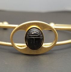 "Only $4 SHIPPING and additional items ship FREE (except doll furniture). Vintage BLACK ONYX SCARAB Cuff Bracelet Egyptian Revival Jewelry Genuine Stone Condition: NOS - New old stock -- jewelry made from vintage materials that were never sold at retail so it is it is \"new\" andunused Marked: No SIZE: Interior of cuff is 5 inches long with a 1 inch gap, Scarab is 10 x 8 mm UPS Ground Shipping is $11 for unlimited number of items.  This is best when you purchase multiple items and need a guarant Handmade Adjustable Black Bangle, Adjustable Black Handmade Bangle, Adjustable Handmade Black Bangle, Black Metal Cuff Bracelet As Gift, Black Metal Cuff Bracelet For Gift, Vintage Adjustable Black Bracelet, Adjustable Black Bracelet For Collectible, Vintage Black Cuff Bracelet As Gift, Vintage Black Adjustable Bracelet