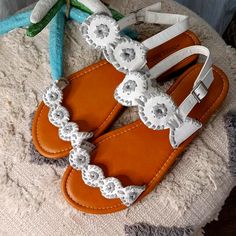 White Faux Leather With Silver Trim Strap Goes Around Back Of Heel And Buckles Size 10 Brand New Never Worn White Ankle Strap Sandals With Adjustable Fit, White Adjustable Ankle Strap Sandals, White Adjustable Summer Sandals, Adjustable White Summer Sandals, White Adjustable Sandals For Beach, Adjustable White Sandals For Beach, Adjustable White Sandals For Spring, White Adjustable Flat Sandals, Rainbow Heels