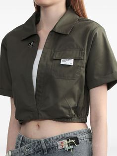 Musium Div. logo-appliqué Layered Cotton Top - Farfetch Utility Cotton Top With Cargo Pockets, Khaki Cotton Tops With Cargo Pockets, Sporty Cotton Tops With Pockets, Utility Style Short Sleeve Tops With Cargo Pockets, Utility Style Collared Tops With Cargo Pockets, Utility Tops With Cargo Pockets And Short Sleeves, Relaxed Fit Collared Tops With Cargo Pockets, Green Crop Top For Streetwear In Spring, Khaki Utility Tops With Pockets