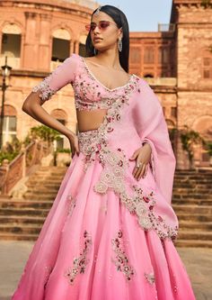 Pink lehenga set with thread work and pearl embroidery. Wedding Embellished Organza Palazzo Set, Traditional Embellished Organza Anarkali Set, Embellished Fitted Raw Silk Lehenga, Embellished Raw Silk Saree Set, Elegant Kundan Palazzo Set For Wedding, Floor-length Organza Set With Intricate Embroidery, Elegant Palazzo Set For Wedding, Designer Embellished Organza Anarkali Set, Anarkali Embellished Organza Sets