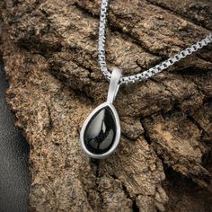 Discover the timeless elegance of our Handmade 925 Stamped Sterling Silver pear cut black onyx Pendant, meticulously crafted by skilled artisans. 𝗙𝗲𝗮𝘁𝘂𝗿𝗲𝘀: * Made from high-quality 925 sterling silver, hallmarked for authenticity * Beautiful natural pear cut black onyx stone * Handcrafted with care and precision, this pendant is both elegant and durable, perfect for everyday wear or special occasions. 𝗦𝗶𝘇𝗲: * Pendant length including bail: 15mm * Pendant width: 7mm * Stone Size: 6mm Black Stainless Steel Necklace For Anniversary, Black Stainless Steel Jewelry With Black Enamel, Anniversary Black Stainless Steel Necklace, Black Teardrop Gemstone Necklace, Elegant Teardrop Stainless Steel Necklaces, Silver Obsidian Gemstone Necklace, Silver Teardrop Jewelry With Black Enamel, Black Drop Jewelry For Anniversary, Black Enamel Necklace For Anniversary