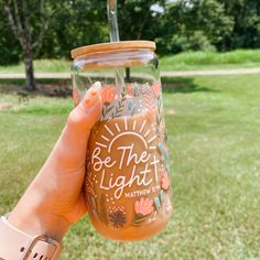 Illuminate your day with our Be The Light 16oz Glass Beer Can Mug! This unique glass cup features intricate floral detailing and meaningful Bible verses, making it a perfect gift for women who appreciate Christian messages. Made with high-quality materials, this cute glass mug is UVDTF-treated for long-lasting vibrancy. Care Instructions: Hand wash gently with warm water and mild soap. Elevate your glassware collection with this religious-inspired piece that radiates positivity and hope. Pair wi Glass Cups With Vinyl Christian, Cute Coffee Cups Designs, Glass Tumbler Painting Ideas, Christian Glass Cups, Can Cup Design, Glass Coffee Cup Design, Glass Tumbler Design Ideas, Water Bottle Design Ideas, Christian Cups