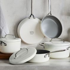 pots and pans are lined up on the counter