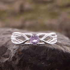 "Celtic style 925 sterling silver womens amethyst promise ring, Unique dainty & elegant promise ring for her, Celtic amethyst engagement ring WE OFFER UNLIMITED PERIOD INSTALLMENTS PLAN This is a beautiful, stunning, feminine ring that works well for all occasions, styles, and ages. You will love it! Ring information Stone: Amethyst Approximate size: 3.5mm Metal type: Silver Metal stamp: 925 Sterling SIlver Customization / Replacements It's easy to create jewelry that's perfect for you. Chan Elegant Amethyst Birthstone Ring In Round Band, Elegant Amethyst Birthstone Ring Round Band, Elegant Purple Birthstone Promise Ring, Elegant Sterling Silver Amethyst Ring With Round Stone, Sterling Silver Amethyst Ring With Center Stone, Elegant Amethyst Diamond Promise Ring, Elegant Amethyst Solitaire Ring With Round Stone, Elegant White Gold Amethyst Promise Ring, Elegant Purple Crystal Promise Ring