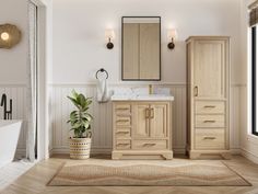 a bathroom with a sink, mirror and bathtub next to a plant in a pot