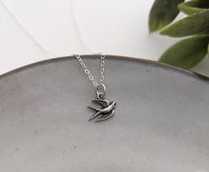 This dainty bird charm measures approximately 14mm (around 1/2"). Necklace card reads "with brave wings she flies". All components of this necklace are made of solid .925 sterling silver. Can be sent directly to gift recipient. Shipping address can be updated at checkout. Will arrive in a gift box ready to make the perfect gift. Tiny Silver Charm Necklaces As Gift For Her, Tiny Sterling Silver Charm Necklace For Her, Tiny Silver Charm Necklace As Gift For Her, Sterling Silver Charm Necklaces As Gift For Her, Adjustable Delicate Sterling Silver Charm Necklace, Sterling Silver Charm Necklace As Gift For Mom, Everyday Tiny Silver Charm Necklaces, Everyday Sterling Silver Nickel-free Charm Necklaces, Everyday Sterling Silver Nickel-free Charm Necklace