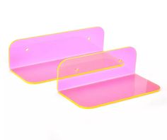 two pink trays with yellow trim on each side and one in the middle, both empty