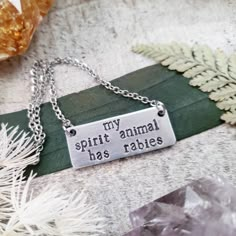 "It wasn't me. It was my spirit animal. \"My spirit animal has rabies\" is stamped onto a silver bar pendant. These funny stamped necklaces make a great gift. - \"My spirit animal has rabies\" ORIGINAL Wanderlust Hearts jewelry quote - Stamped aluminum bar pendant - Stainless steel chain - Measures 1.25\"x .5\" 2017©Wanderlust Hearts designs All Rights Reserved. WanderlustHearts' Jewelry and Accessories are the intellectual property of WanderlustHeartShop My designs are not to be duplicated in p Hearts Jewelry, Funny Jewelry, Stamped Necklaces, Metal Stamped Jewelry, Animal Necklace, My Spirit Animal, Jewelry Quotes, My Spirit, Silver Bar