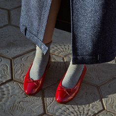 Red patent ballet flats Ballet flats don’t get more classic than the Oriana. They’re shaped from red patent leather with a slip-on silhouette, then trimmed along the topline and embellished with bows at the almond toe. Repetto Outfit, Red Ballet Flats Outfit, Red Ballerina Flats, Red Flat Shoes, Red Leather Ballet Flats, Red Shoes Outfit, Red Stuff, Red Ballet Flats, Patent Leather Ballet Flats