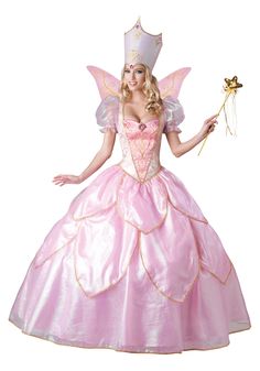 a woman in a pink fairy costume holding a wand and wearing a tiara with wings