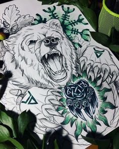 a drawing of a bear with an eagle on it's back and leaves surrounding it