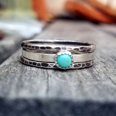 "This beautiful stacking ring set includes 3 sterling silver rings. One 2mm band with a semi-precious stone of your choice and two hammered 14 gauge rings. The 2mm band features a 4mm bezel cup stone setting with your option of Light Turquoise (shown), Turquoise, Blue Lapis, Onyx, Mother of Pearl, or Carnelian. Available in completely polished finish or the two hammered rings in antiqued finish for a nice contrast. Please specify your finish in the \"note to seller\" during checkout. If you don' Sterling Silver Stacking Rings, Stacking Ring Set, Hammered Rings, Silver Stacking Rings, Blue Lapis, Light Turquoise, Stone Setting, Stacking Ring, Stone Settings