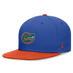 a blue and orange hat with an alligator's head on the front, one side is